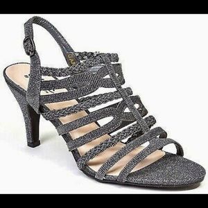 New, Chic dressy pewter strapy heals. Size 11